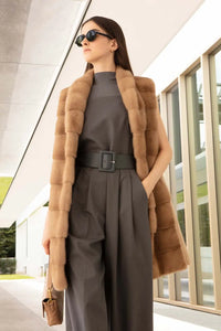 Cashmere knee-length mink vest for women. Shawl collar, concealed pockets, straight bottom and closure with fur hooks 