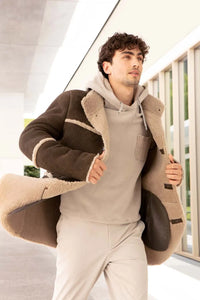 Real  sheepskin coat mens with high collar. Beige shearling lining. 4 buttons fastening. Sheepskin profiles on body and sleeves