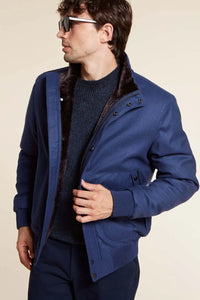 Short fur lined bomber jacket mens with high collar. Zip fastening. Blue LoroPiana fabric with dark sheepskin lining. Suede inserts