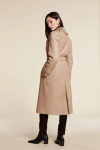 Long shearling coat womens, style trench coat made of beige leather with matching shearling lining. Fitted line. Belt fastening