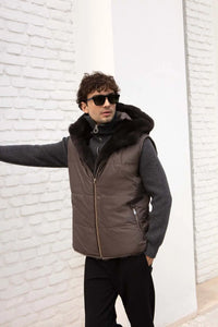 Short mens mink vest with hood made of soft  beaver fur, cashmere and tech-fabric. Reversible. Padded and quilted. Zip fastening