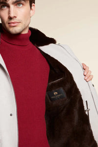 Short mens winter jacket with fur hood made of cashmere fabric with brown beaver fur lining. Fastening with concealed zip and snaps. 