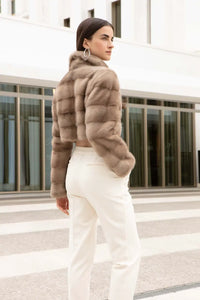 Short mink jacket womens with wide lapel collar, 2 front buttons, belt with loops both on the body hem and on the sleeves