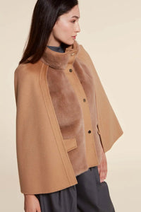 Short beige mink jackets women with inner collar, flap pockets and front buttoning in cashmere. Zip and snap button closure