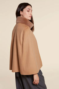 Short beige mink jackets women with inner collar, flap pockets and front buttoning in cashmere. Zip and snap button closure