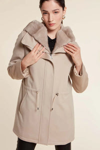 Parka coat with fur hood and high collar. Zip fastening. Removable fur hood with press studs. Padded and quilted internally