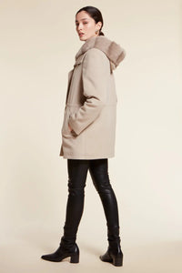 Parka coat with fur hood and high collar. Zip fastening. Removable fur hood with press studs. Padded and quilted internally