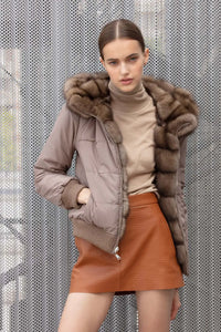 Reversible russian sable fur jacket with hood and dropped sleeves, wool cuffs and hem. Zip fastening. Pockets with zip