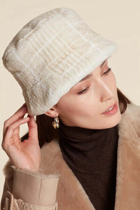 White mink hat with contrast prints in beige. Beige cotton lining