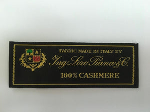 fabric made in Italy by Ing Loro Piana Loropiana & C 100% cashmere. Label of coat textile production